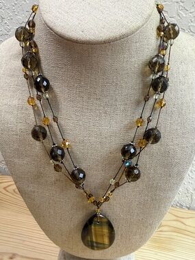 Layered Amber-Tone Beaded Necklace with Striped Teardrop Pendant